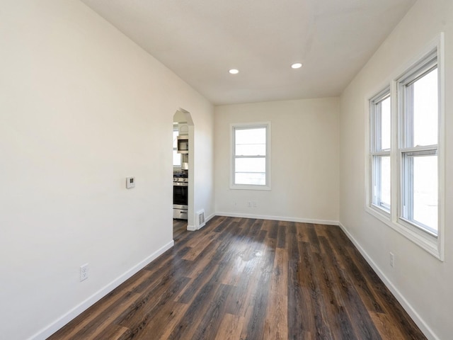 unfurnished room with dark hardwood / wood-style floors