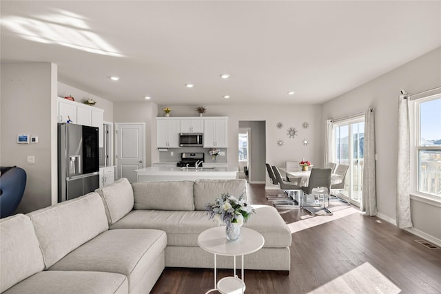 living room with dark hardwood / wood-style floors