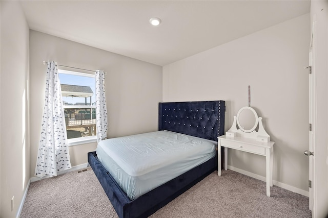 bedroom featuring light colored carpet