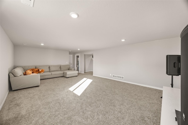 unfurnished living room featuring light carpet