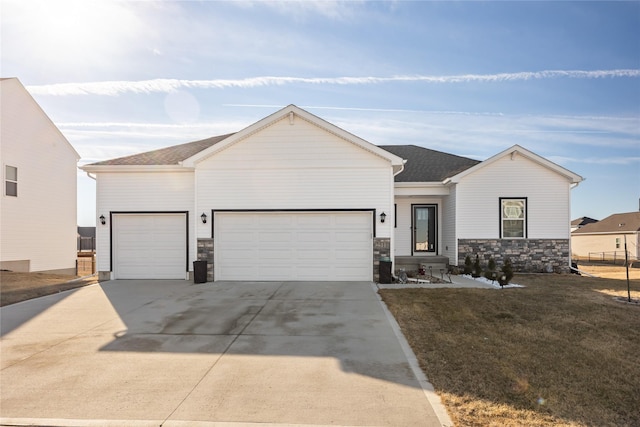 view of front of house with a garage and a front yard