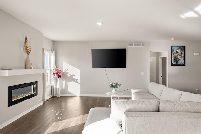 living room featuring dark wood-type flooring