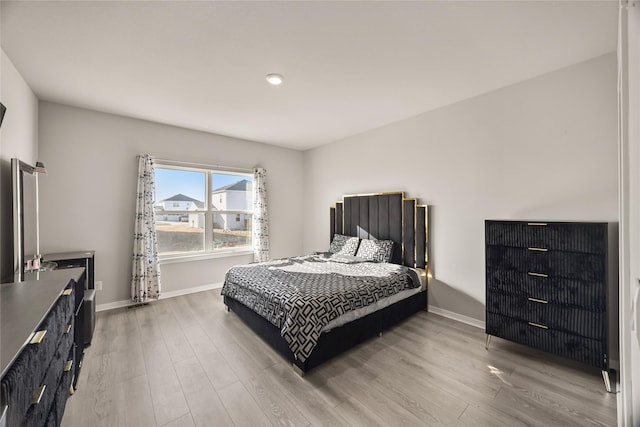 bedroom with wood-type flooring