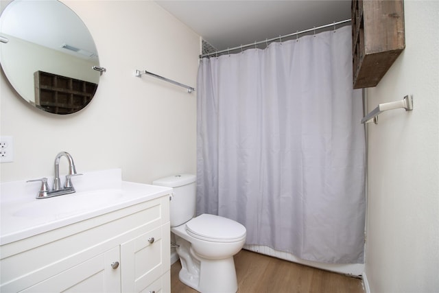 bathroom with a shower with curtain, vanity, toilet, and hardwood / wood-style floors