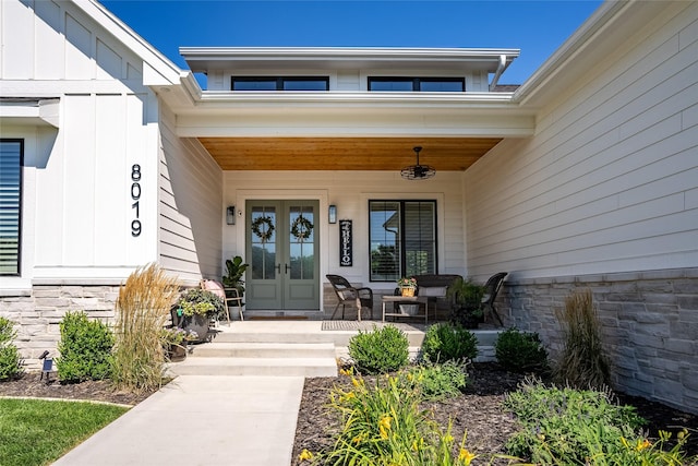 view of exterior entry with a porch