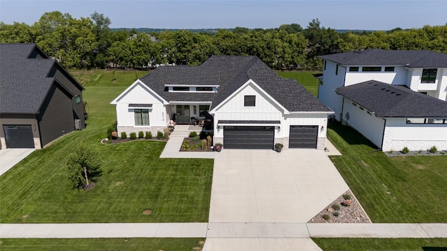 modern inspired farmhouse featuring a porch and a front lawn