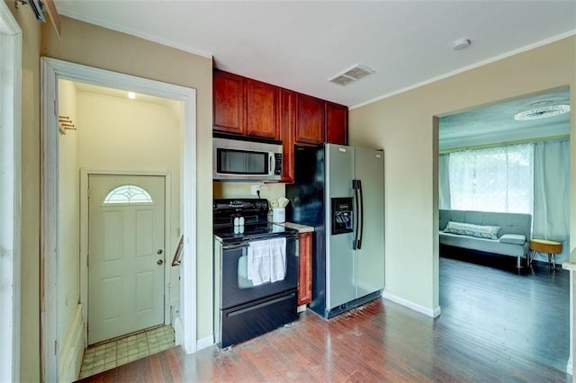 kitchen with ornamental molding, wood-type flooring, and stainless steel appliances