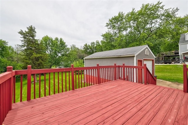 deck with a garage, an outdoor structure, and a lawn