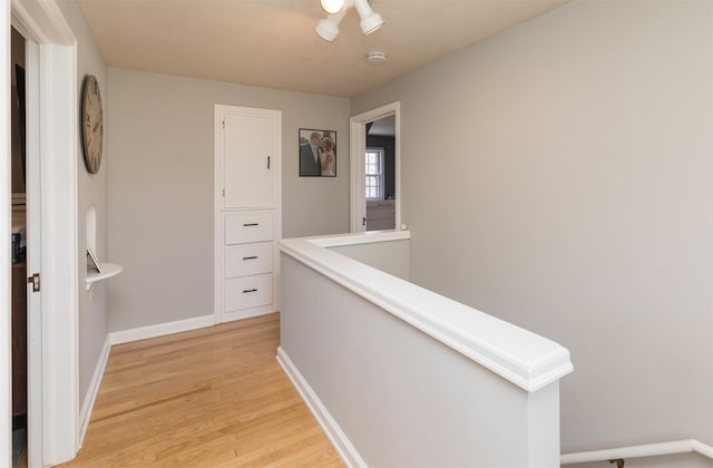 hall with light hardwood / wood-style flooring