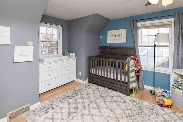 bedroom featuring ceiling fan and light wood-type flooring