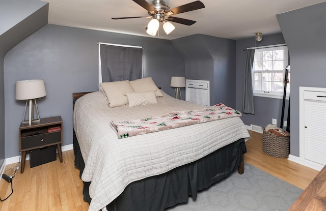 bedroom with ceiling fan and light hardwood / wood-style flooring