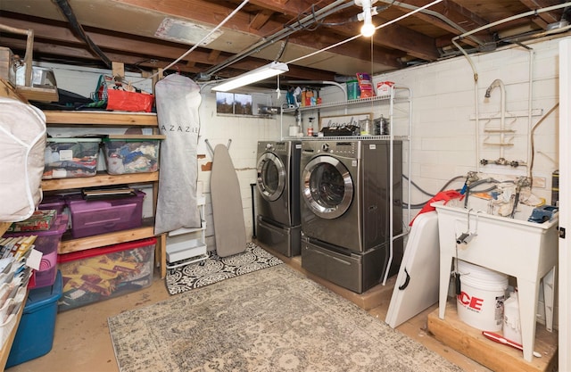 washroom with washing machine and dryer