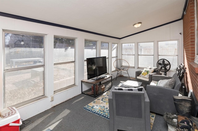 sunroom / solarium featuring lofted ceiling