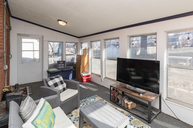 carpeted living room with vaulted ceiling and crown molding