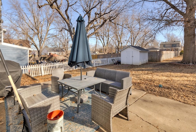 view of patio / terrace featuring grilling area and a storage shed