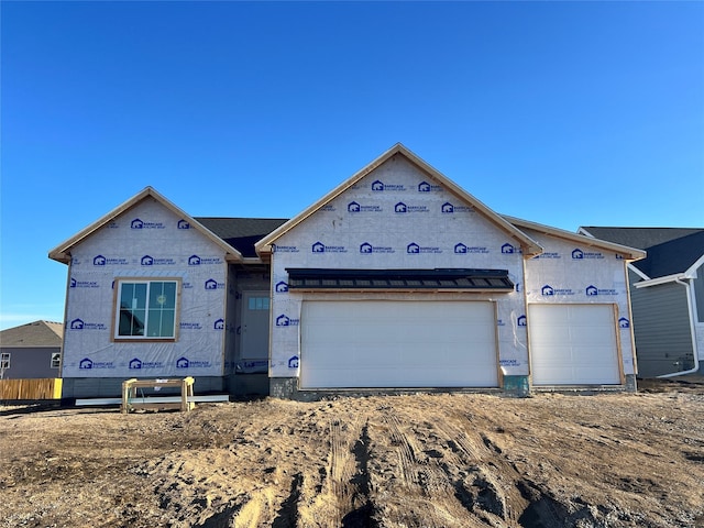 unfinished property with a garage