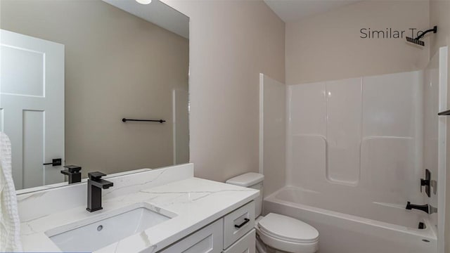 full bathroom with vanity, bathing tub / shower combination, and toilet