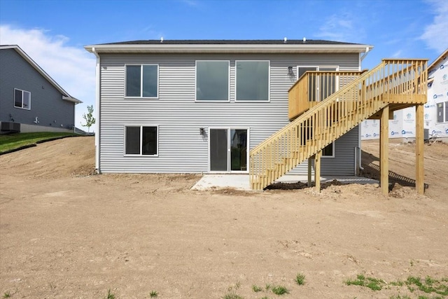575 NW Prairie Rose Ln, Waukee, IA 50263 - rear view of house featuring stairs and a deck
