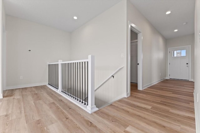 575 NW Prairie Rose Ln, Waukee, IA 50263 - corridor featuring an upstairs landing, light wood finished floors, baseboards, and recessed lighting