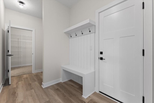 575 NW Prairie Rose Ln, Waukee, IA 50263 - mudroom featuring wood finished floors and baseboards