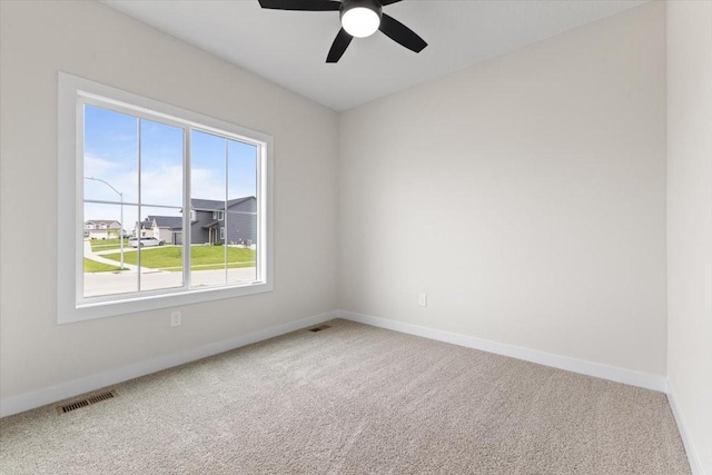 575 NW Prairie Rose Ln, Waukee, IA 50263 - carpeted spare room featuring a ceiling fan and baseboards