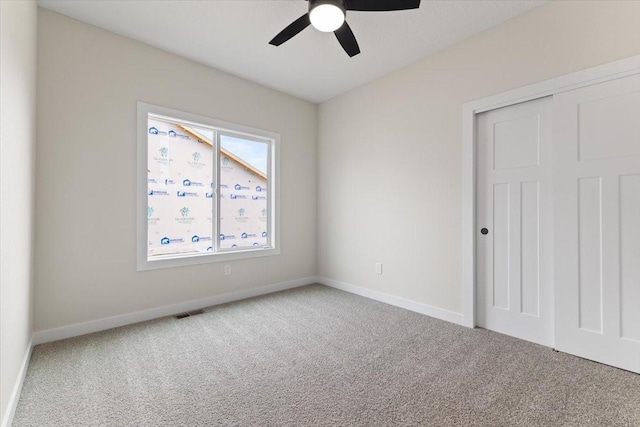 575 NW Prairie Rose Ln, Waukee, IA 50263 - unfurnished bedroom featuring carpet floors, baseboards, a closet, and ceiling fan