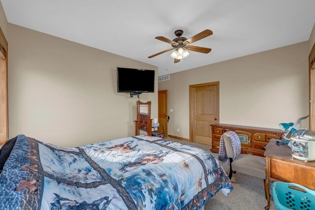 bedroom featuring ceiling fan and carpet