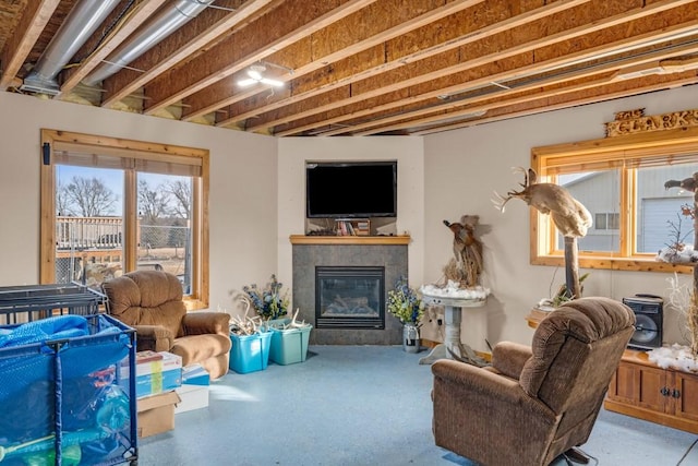 living room featuring a tile fireplace