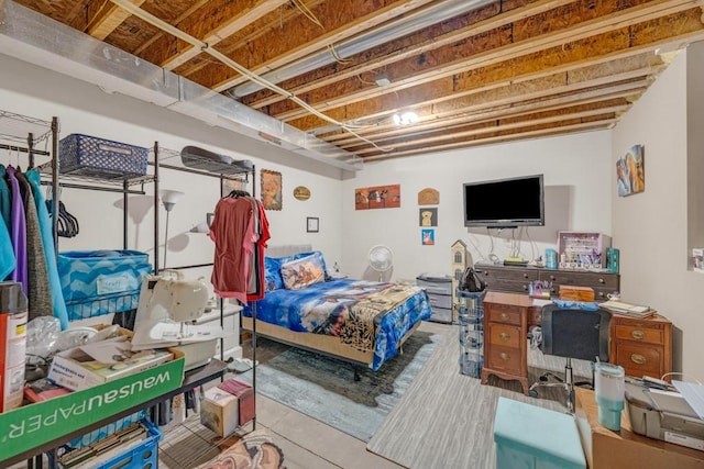 bedroom featuring concrete flooring