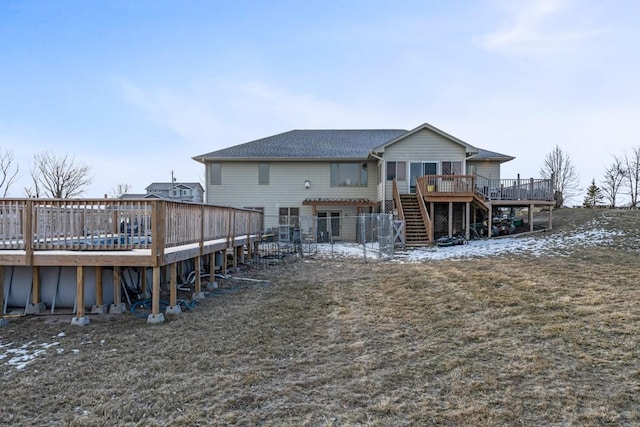 back of house featuring a deck