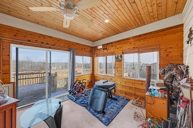 sunroom / solarium with ceiling fan and wood ceiling