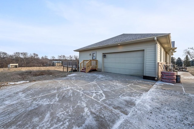 view of side of property with a garage