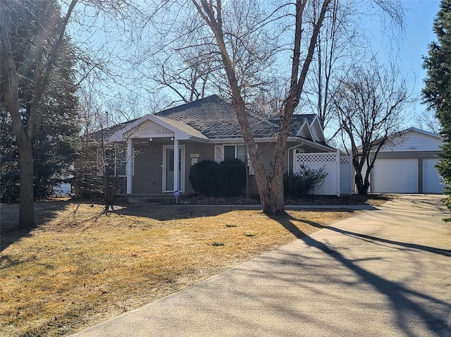 view of front of home featuring a garage and a front lawn