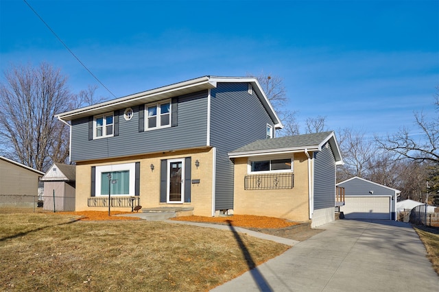 view of front of property with an outbuilding, a garage, and a front yard