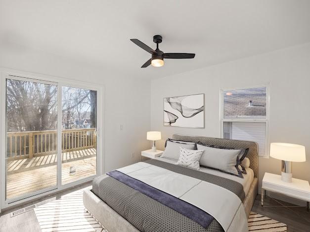 bedroom featuring access to exterior, hardwood / wood-style floors, and ceiling fan