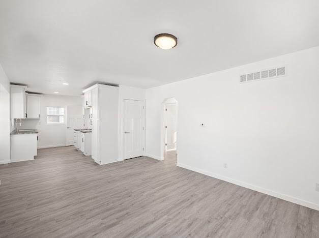 unfurnished living room featuring light hardwood / wood-style flooring