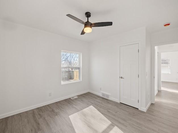 unfurnished bedroom featuring ceiling fan and light wood-type flooring