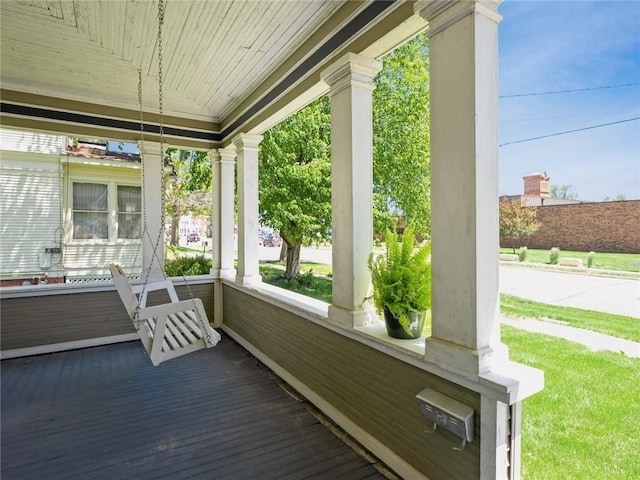 wooden terrace featuring a porch