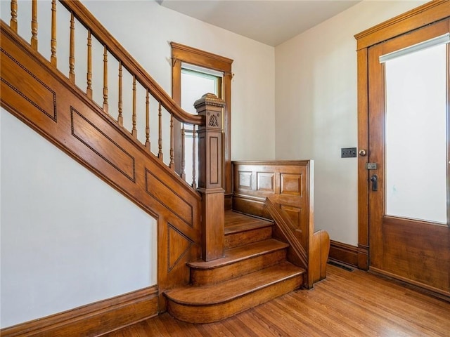 staircase featuring hardwood / wood-style flooring