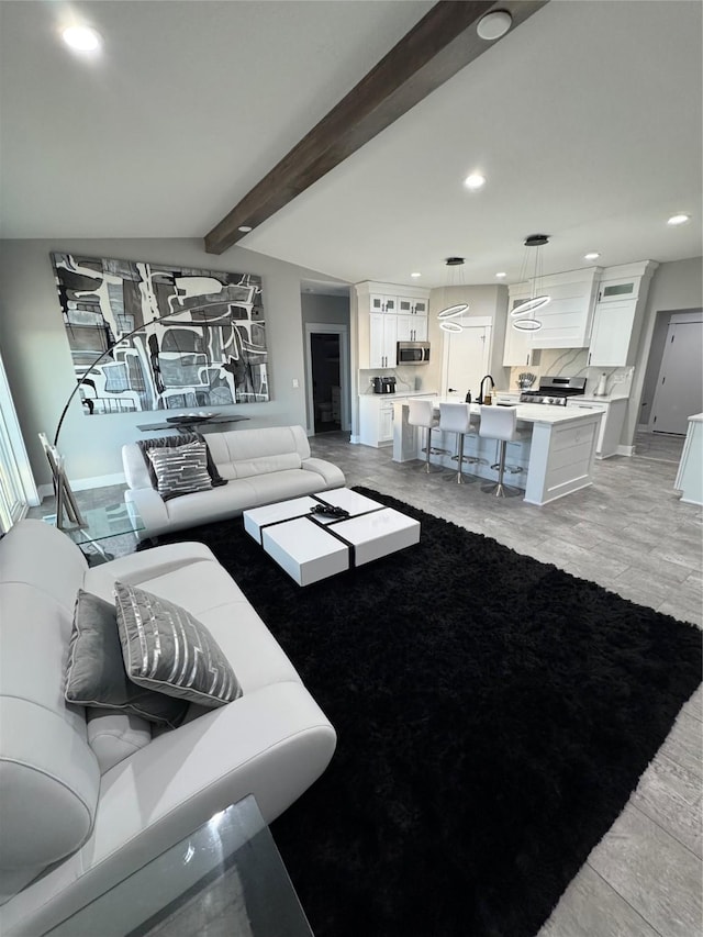 living room with beam ceiling