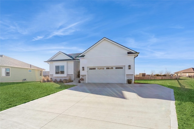 view of front of property featuring a garage and a front lawn