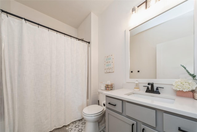 full bathroom featuring vanity, shower / bath combination with curtain, and toilet