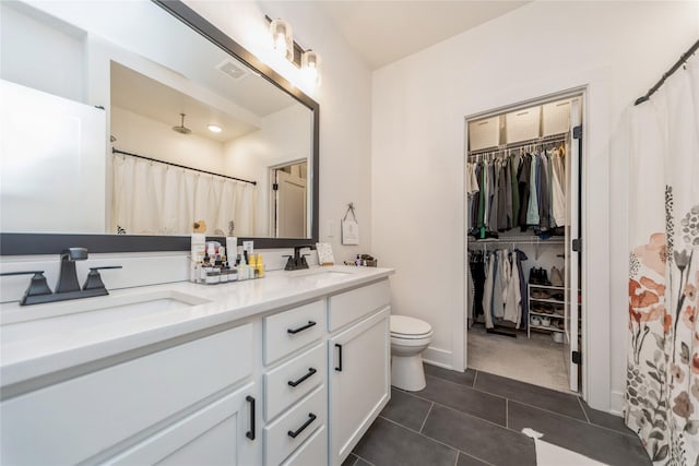 bathroom with vanity, a shower with curtain, tile patterned floors, and toilet