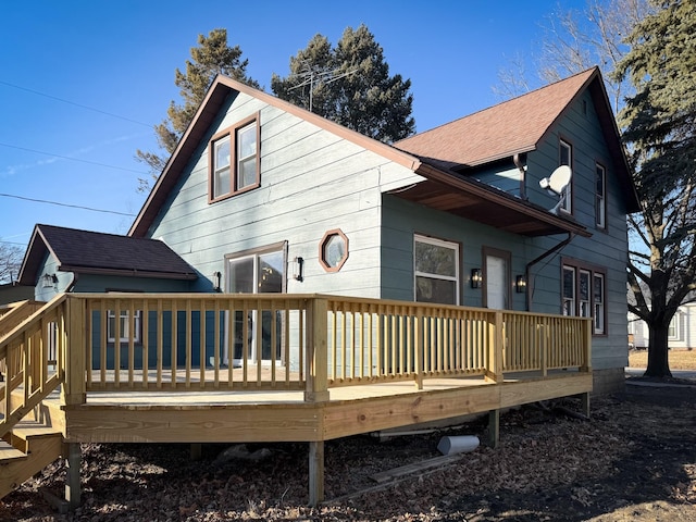 back of house with a wooden deck