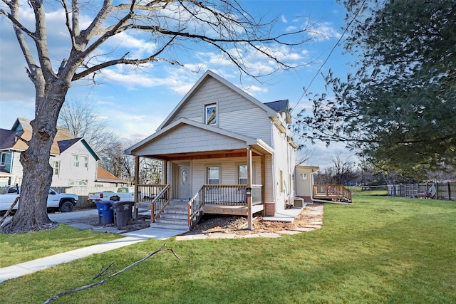 bungalow-style house featuring a porch and a front yard