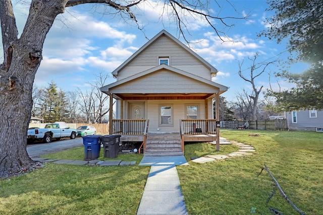 bungalow-style house with a porch and a front yard