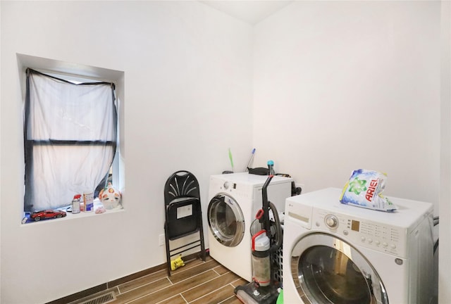 washroom featuring washing machine and dryer