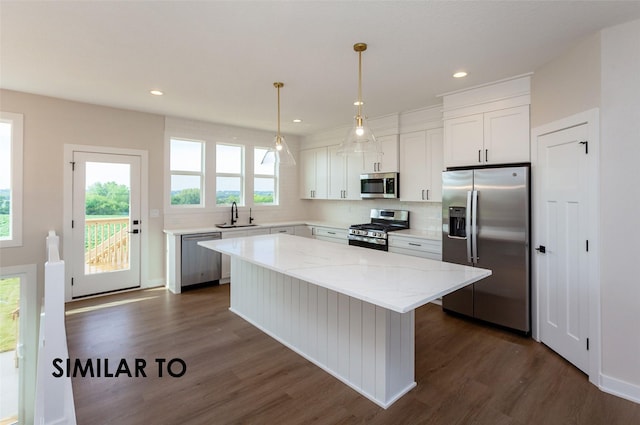 kitchen featuring a center island, white cabinets, and appliances with stainless steel finishes