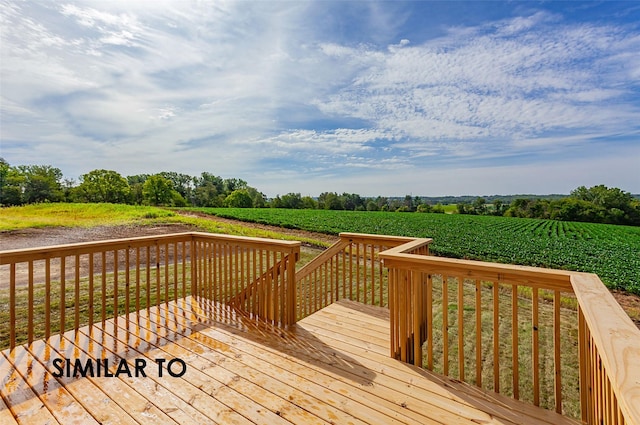 wooden deck featuring a rural view