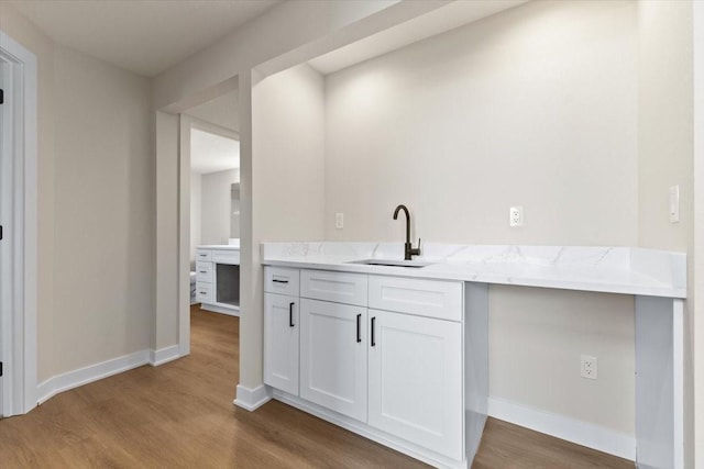 612 W Walnut Pl, Norwalk, IA 50211 - bar featuring a sink and wood finished floors